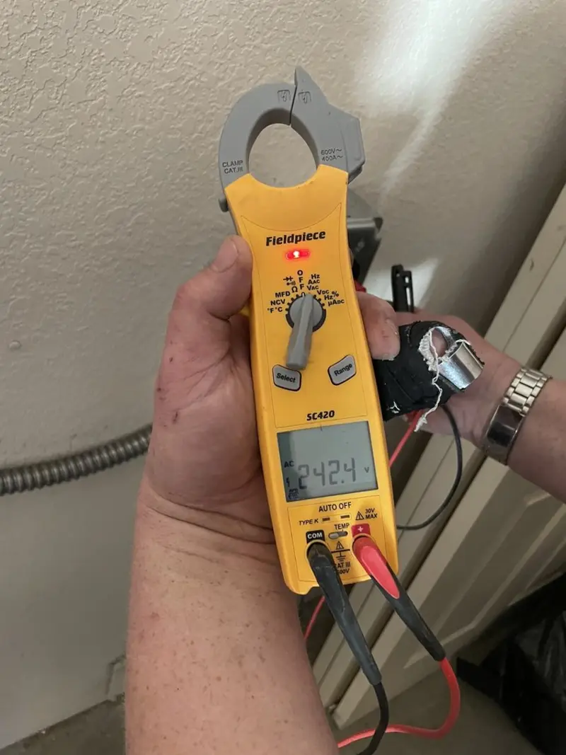 Voltage testing with clamp meter during Whole House Surge Protector in Grangeville